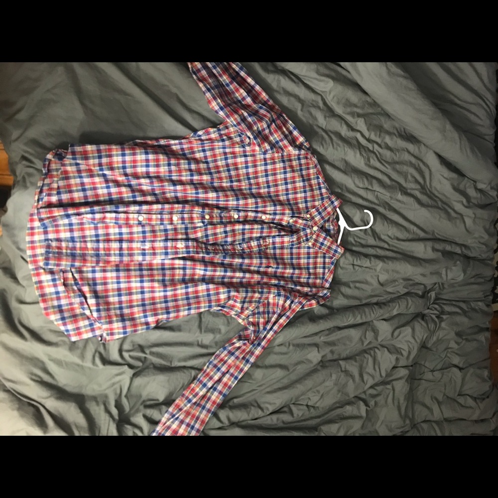 Red patterned button down shirt.